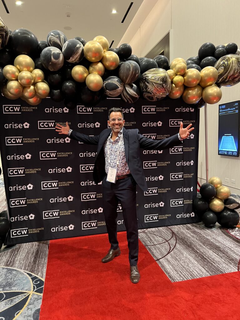 Ravin Shah, Hellohire CEO, posing at the CCW Excellence Award photo set-up