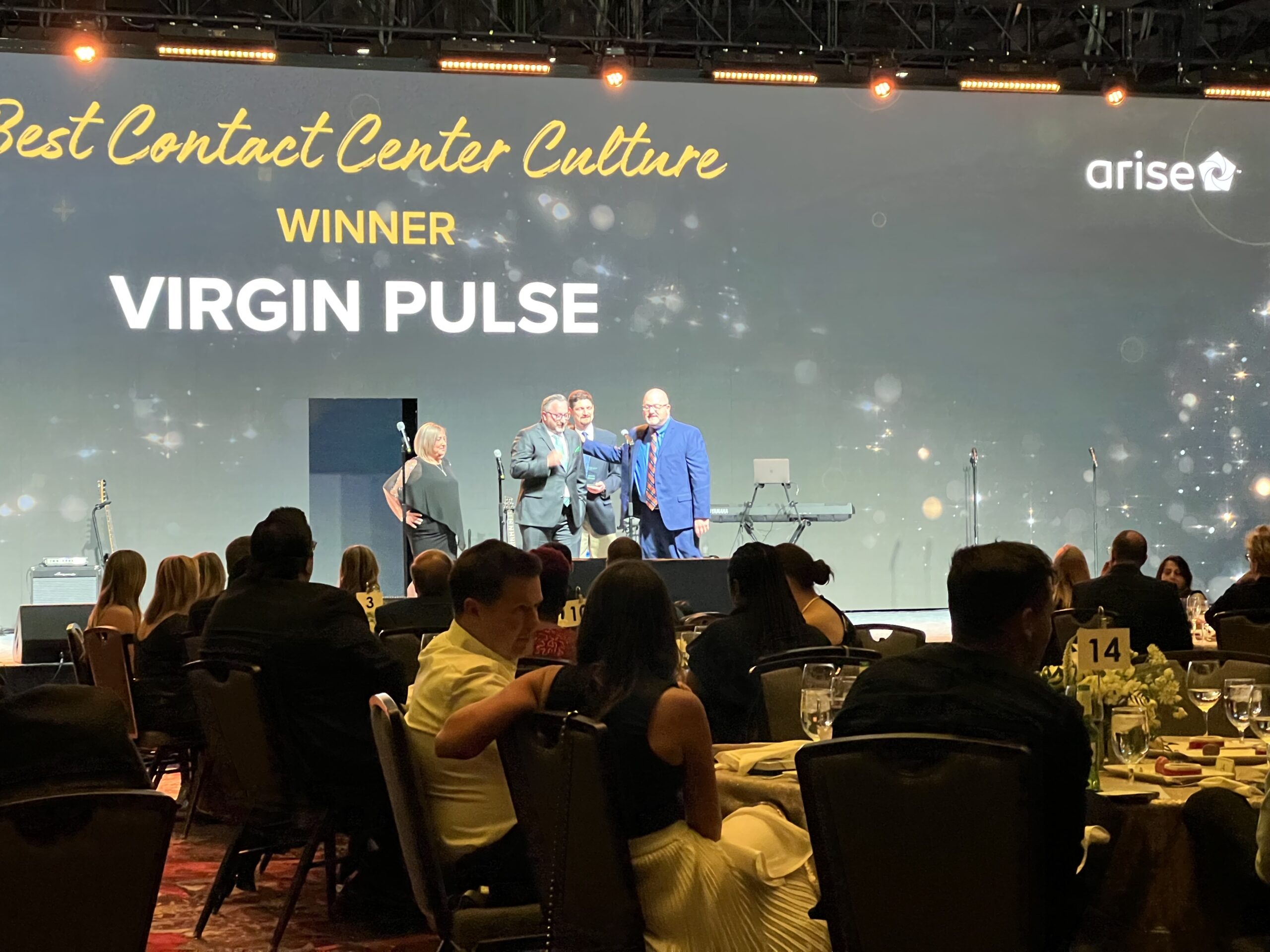 CCW Excellence Awards stage presenting award for Best Contact Center Culture to Virgin Pulse