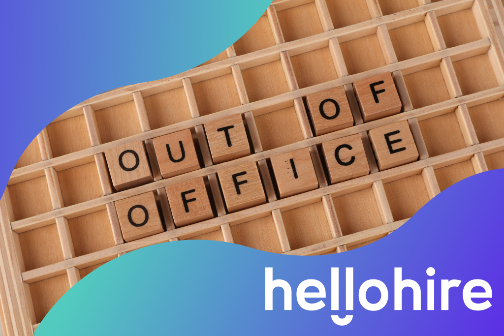Out of office sign on a wooden background